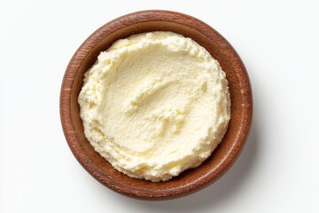 Creamy, pale yellow spread in a wooden bowl