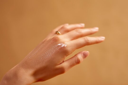 Skin care products show the effect of application on the back of the hand for women's fingers