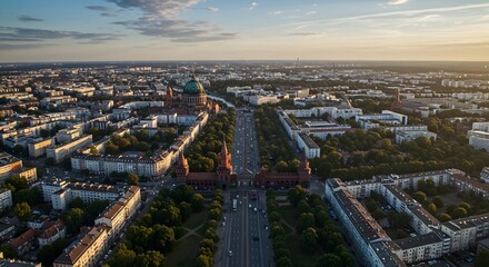 Obraz premium Aerial View of Cityscape with Roads, Buildings and Trees