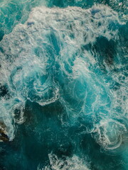 Aerial View of the Sea and Waves. The vast ocean stretches endlessly, with waves. Nature, tranquility, and adventure.	