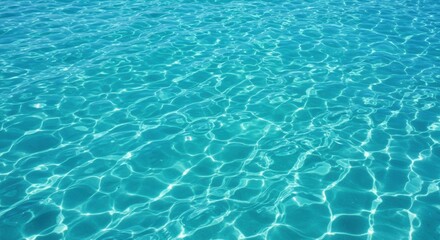 Obraz premium Crystal-clear turquoise water surface reflecting sunlight, serene and inviting