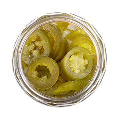 Pickled green jalapeno slices in an open screw-top glass jar, isolated, from above. Medium-sized hot, green chili peppers, cut into cross sections, pasteurized and preserved in a salted vinegar brine.