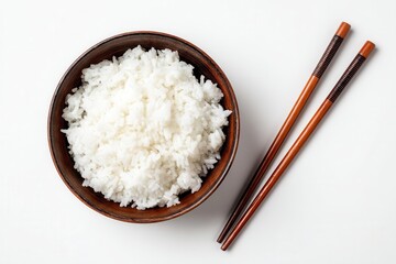 Bowl of fluffy white rice with chopsticks on a clean white background, ideal for food photography