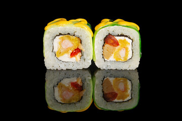 Sushi rolls with shrimp cream cheese and sweet pepper topping