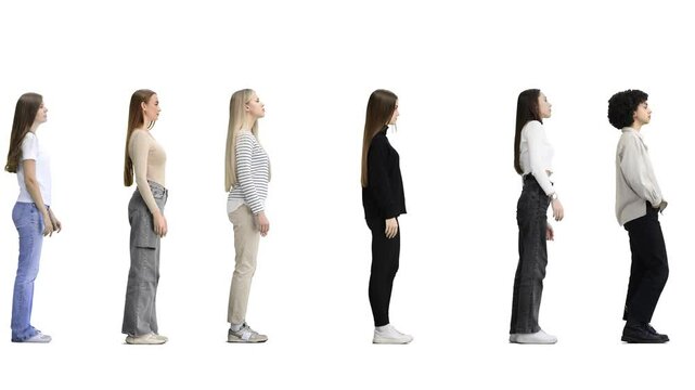 A full-length group of people on a white background are standing in line