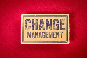 Change Management. Text on Vintage Cardboard Label. Red Background