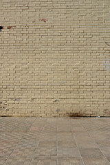 Old brick wall and cobblestone floor