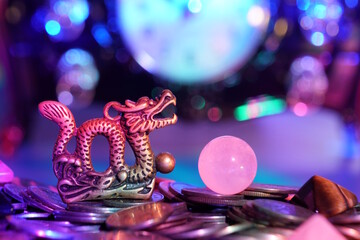 A dragon figurine and a quartz ball.