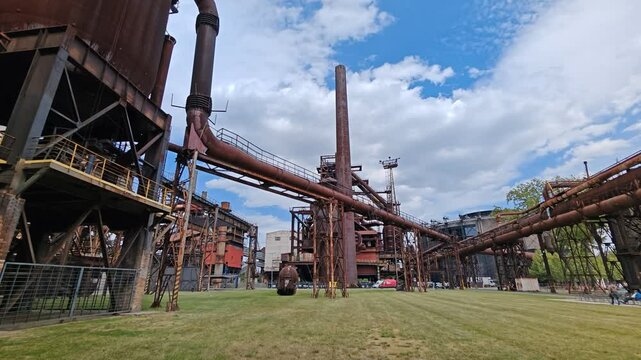 Rusty steel pipes in giant industrial complex near Ostrava Vitkovice and Bolt Tower, famous urbex exploration site.

