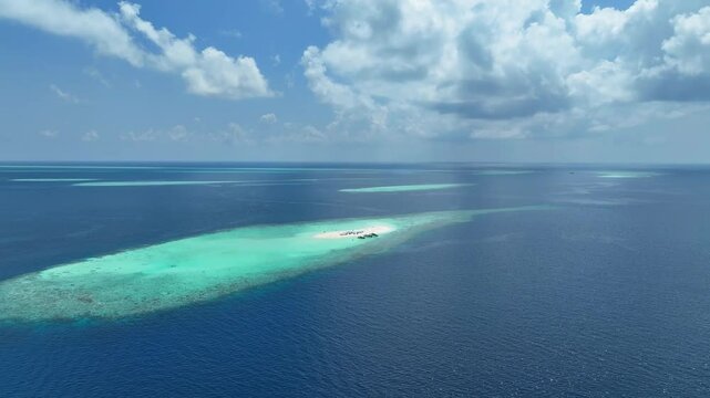 Summer lagoon Ripples in the sand at low tide on a beach with sandbar and blue sea in Maldives island	