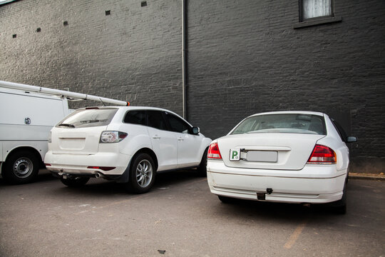 P2 plate car parked over line in car park
