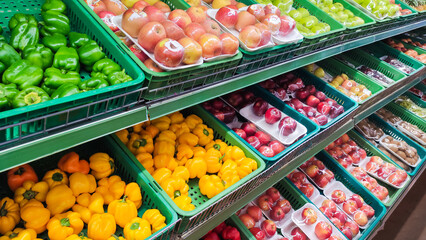 fresh fruit and ripe vegetables in a mart or supermarket background