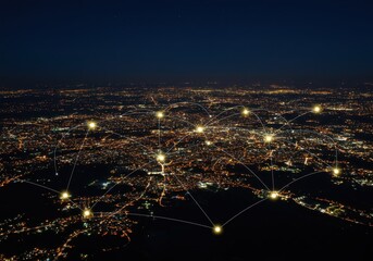 City at night illuminated with a network of connected light points across the urban landscape
