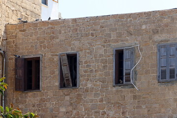Ruins of old houses in the center of a big city