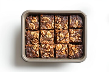 Delicious homemade brownie squares topped with walnut pieces
