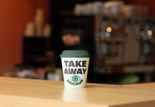 Showcase of takeaway coffee cup on countertop in cafe.