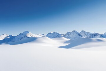 Obraz premium Snow-covered mountain range under a clear blue sky