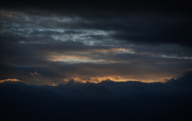 Sunset sky with orange clouds. Nature background.