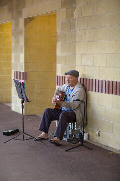 Busker playing guitar