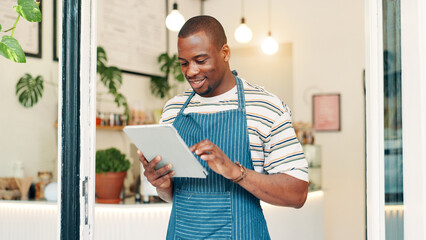 Barista, tablet and reading with black man in cafe for research, digital inventory or restaurant supply checklist. Waiter, catering review and small business owner with person in coffee shop for menu