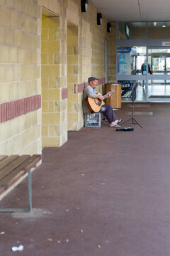 Busker in empty mall