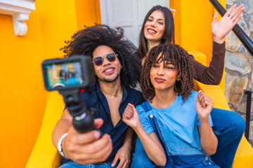 Content creators filming a video blog with action camera