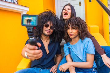 Content creators filming a video blog with a gimbal and action camera