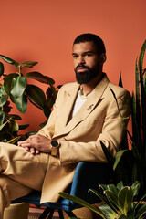 Handsome young man exudes summer vibes in stylish light suit surrounded by lush greenery