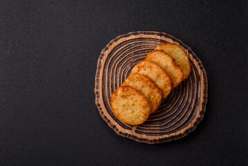 Potato hash browns, a meal with onions, cabbage in the form of fritters