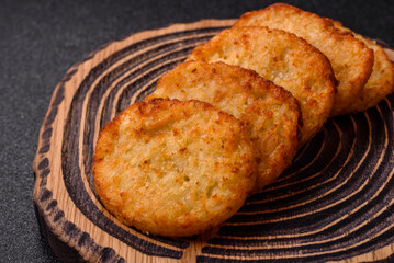 Potato hash browns, a meal with onions, cabbage in the form of fritters