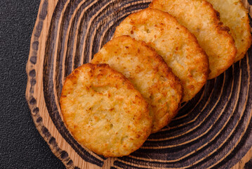 Potato hash browns, a meal with onions, cabbage in the form of fritters