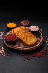 Potato hash browns, a meal with onions, cabbage in the form of fritters
