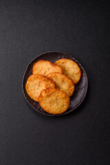 Potato hash browns, a meal with onions, cabbage in the form of fritters