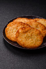 Potato hash browns, a meal with onions, cabbage in the form of fritters