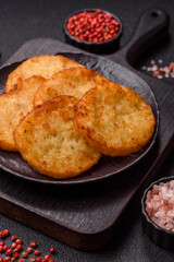 Potato hash browns, a meal with onions, cabbage in the form of fritters