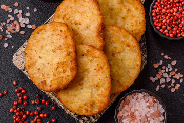Potato hash browns, a meal with onions, cabbage in the form of fritters