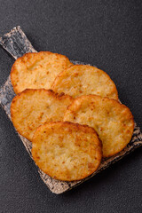 Potato hash browns, a meal with onions, cabbage in the form of fritters