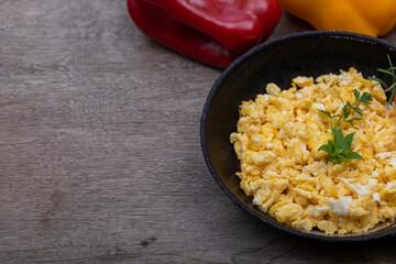 Scrambled eggs in metal pan