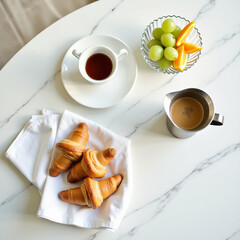 Minimalist Flat Lay of Breakfast Items on a White Table
