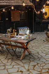 Charming backyard wooden table set for a private dinner party
