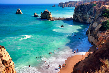 Lagos, Algarve, Faro district, Portugal, Europe - People bathing in Atlantic Ocean, Pinhao Beach...