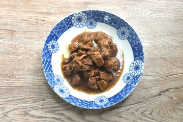 salty boiled slice dice pork meat in soy sauce on plate