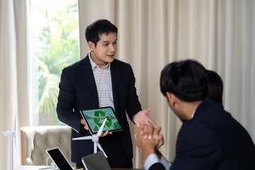 Sustainability and ESG. Businessman presenting ESG concepts to colleagues in a meeting.