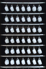 Rows of many empty white cups for coffee or tea in seminar event or meeting room