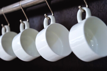 Rows of empty white cups for coffee or tea in seminar event or meeting room