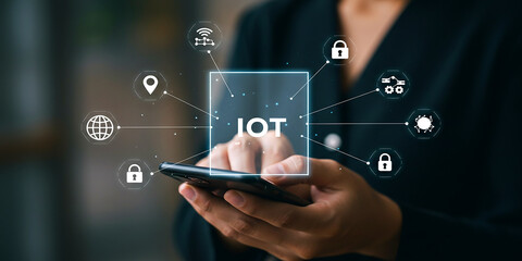 Businessman holding mobile phone with holographic icons representing secure payment and technology