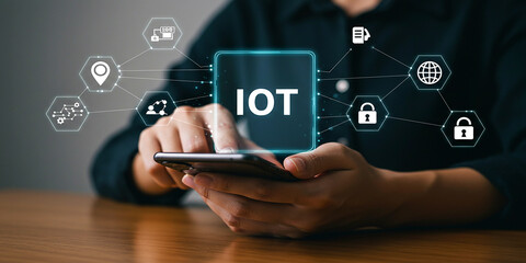 Hand holding digital interface with internet of things icons representing smart network connection