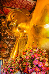 The Big golden Reclining Buddha within Wat Pho is the important in Bangkok, Thailand