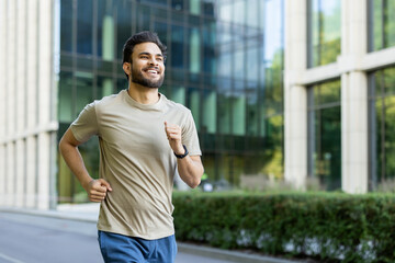 A happy man runs in the city, enjoying the benefits of a fitness routine for wellness.