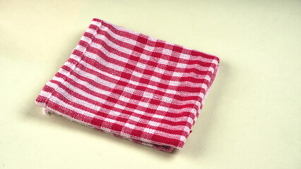 Clean sponge cloths with a checkered pattern isolated on white background. Household cleaning...